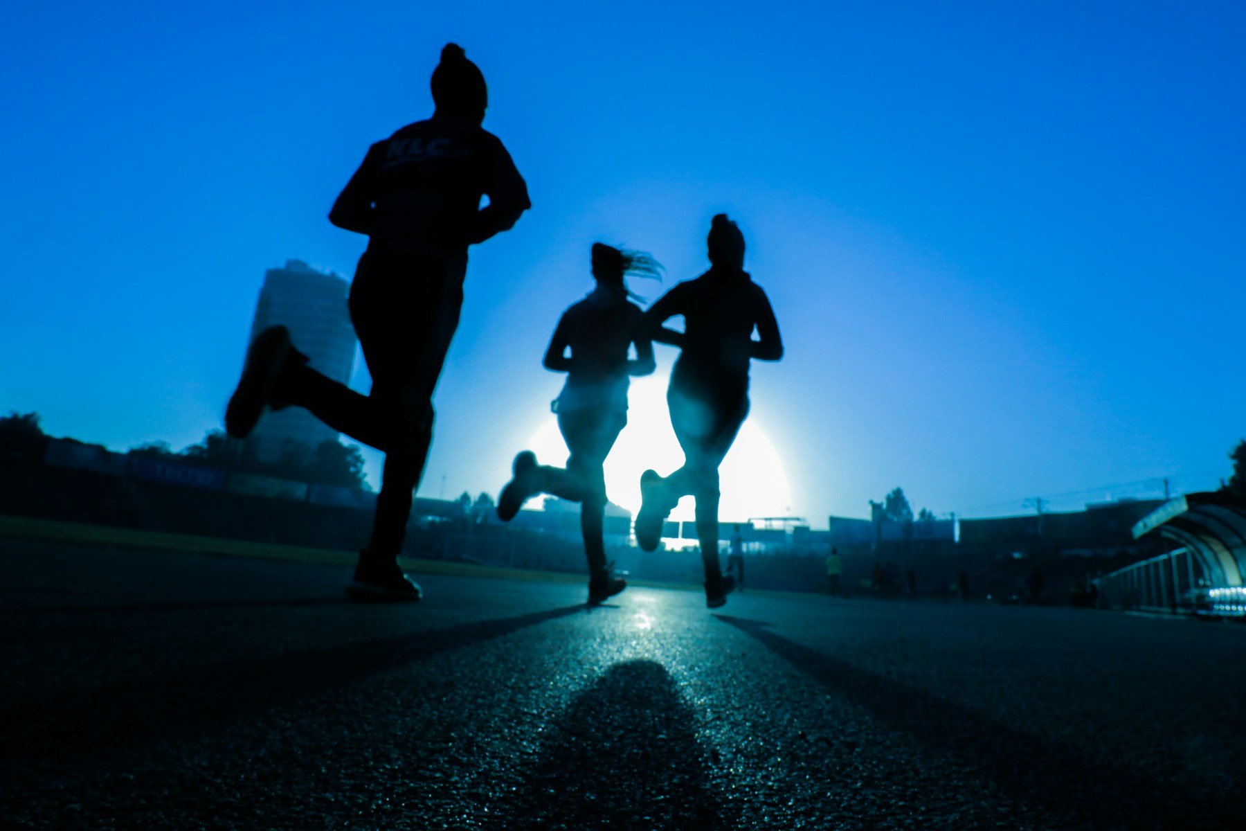 A group of runners training outdoors together